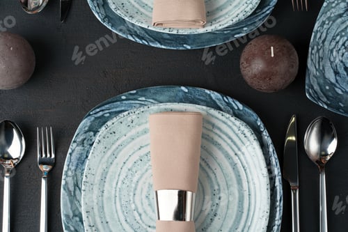 Preview: Table setting. Plates with abstract pattern on black table