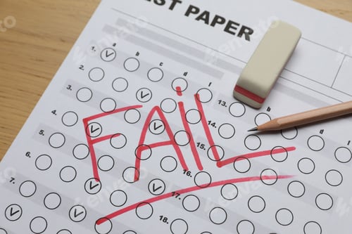 Preview: Answer sheet with word Fail, eraser and pencil on table, closeup. Student passing exam