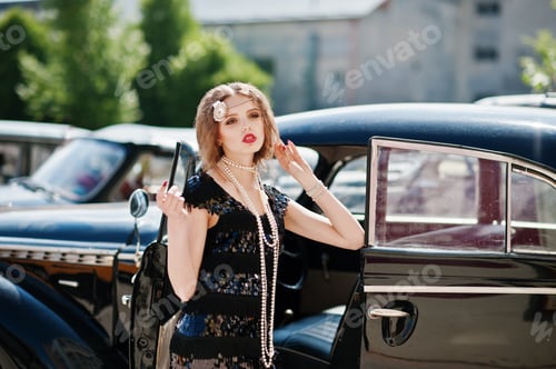 Preview: Girl model with bright makeup in retro style in vintage car