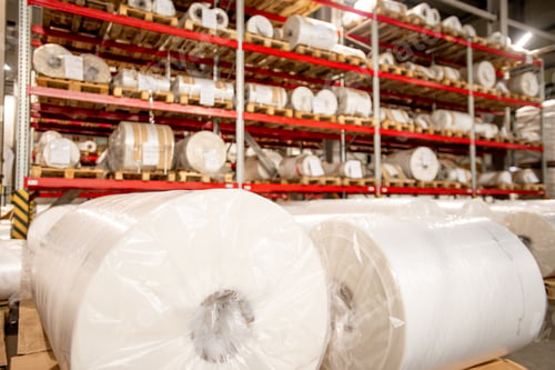 Preview: Racks of rolled and packed polyethylene film in storage area