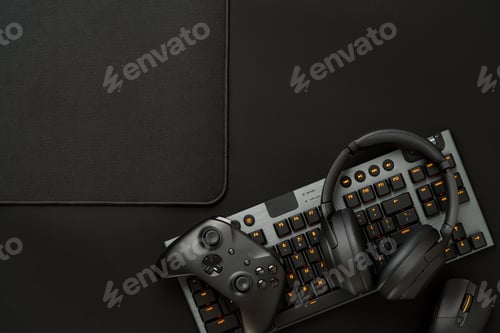 Preview: Gaming concept on black background with computer keyboard and joystick