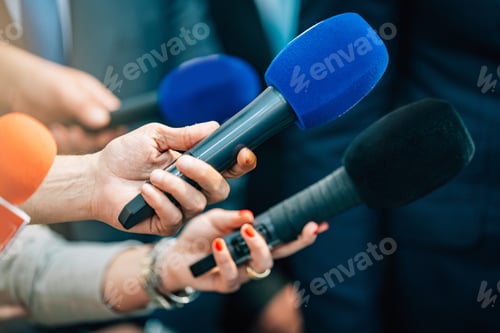 Preview: Media interview microphones after a press conference.