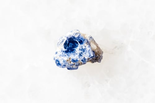 Preview: sample of rough blue spinel crystal on white