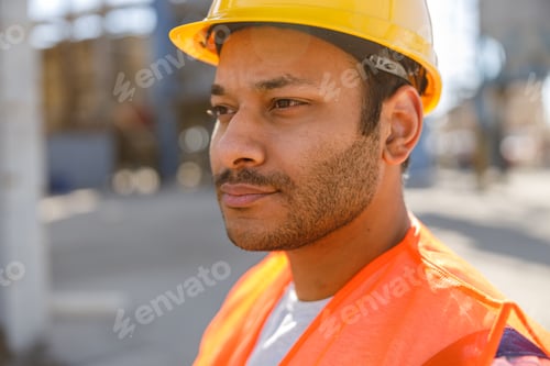 Preview: Experienced worker standing in front of concrete plant