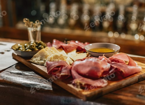 Preview: Ham, cheese and olives served on wooden board. Snack, brunch, food, local cuisine, cold cuts.