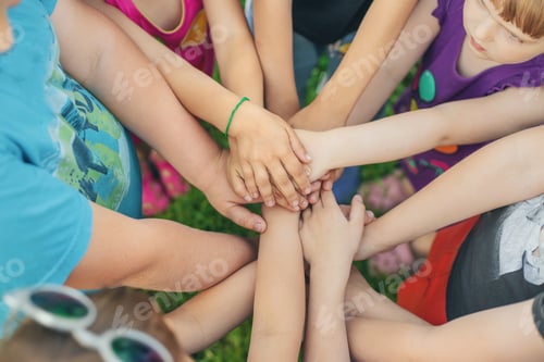 Preview: Children's hands together, street games. Selective focus.