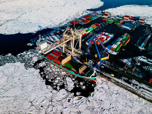Preview: Industrial port with containers in winter, vessel loading