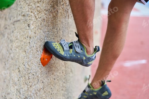 Preview: Climber's foot finding grip on climbing wall holds
