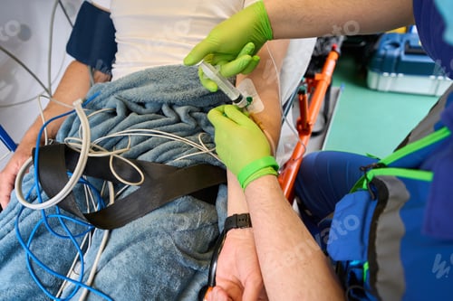 Preview: Visiting team doctor injects medicine to a patient