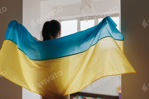 Preview: Symbolic Representation Woman's Rear View Holding Ukrainian Flag