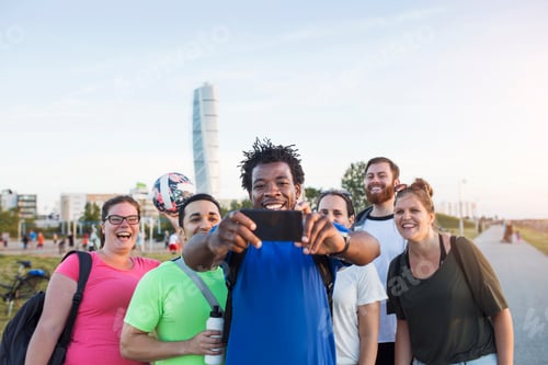 Preview: Friends taking selfie with smartphone