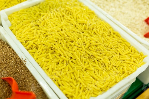 Preview: Macaroni, pasta in boxes on the counter in the supermarket. buying cereals in the store.