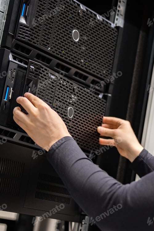 Preview: Close-up of IT Consultant Installing Servers In Enterprise Datacenter