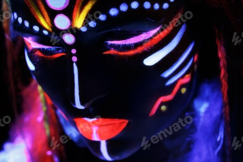Preview: Woman in image of Native American with neon makeup, which made of fluorescent paint