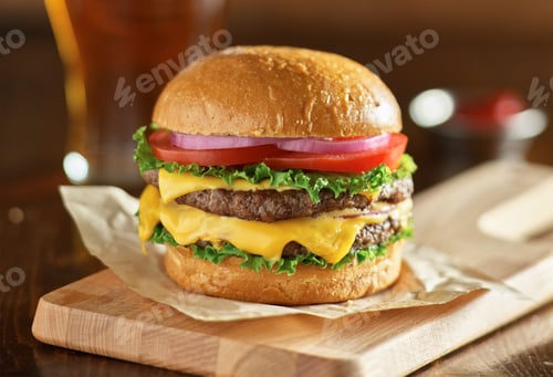 Preview: double cheeseburger with lettuce, tomato, onion, and melted american cheese