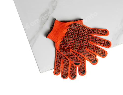 Preview: Ceramic tiles and gloves on white background, top view