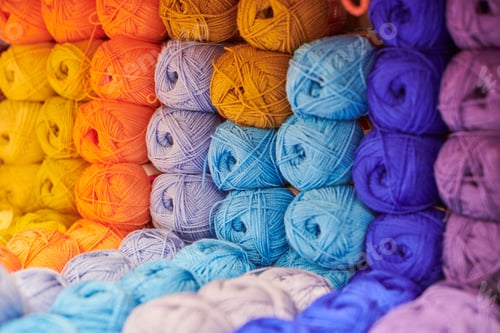 Preview: Yarns or balls of wool on shelves in store for knitting