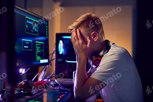 Preview: Stressed Teenage Boy Being Bullied Online Whilst Gaming At Home