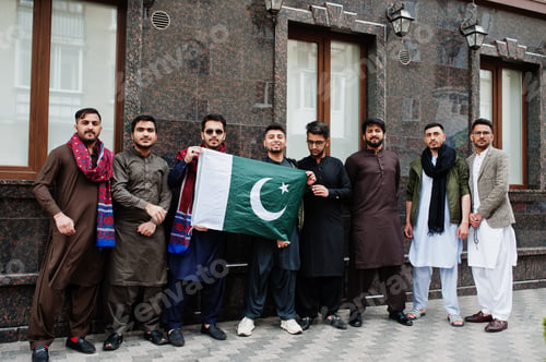 Preview: Group of pakistani man wearing traditional clothes salwar kameez or kurta with Pakistan flags.