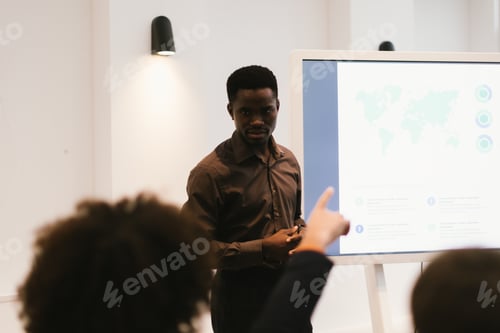 Preview: Businessman leading presentation about global strategy in modern office