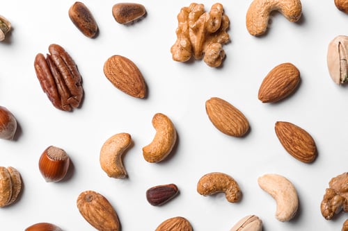 Preview: Composition with organic mixed nuts on white background, top view