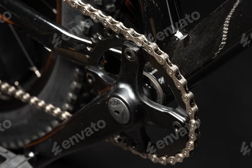 Vista previa: New bicycle chain part close up on black background