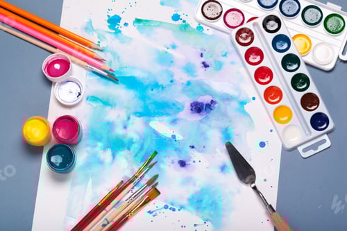 Preview: Top view of work process of watercolor paper pad, watercolor painting supplies and brushes