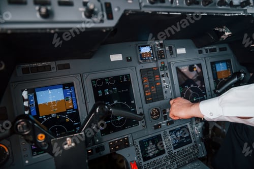 Preview: Close up view. Pilot on the work in the passenger airplane. Preparing for takeoff
