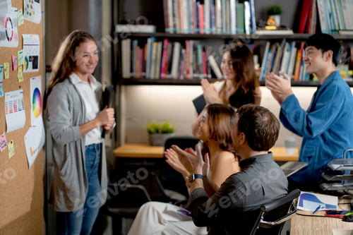 Preview: Business team are clapping hands for success of woman staff from the project