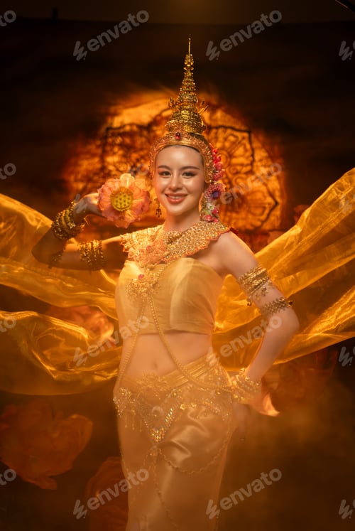 Preview: A beautiful woman in traditional Thai costume performing a classical dance