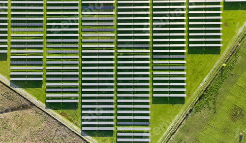Preview: Solar panels on field in summer, aerial drone view