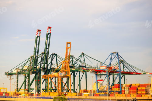 Preview: Industrial cranes and shipping containers at a port. of Valencia, Spain