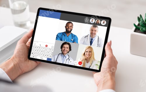 Preview: Doctors Having Online Meeting Via Video Call On Tablet Indoor
