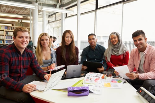 Preview: Group Of Students In Library Collaborating On Project