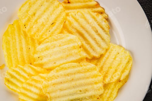 Preview: potato chips ribbed fast food tasty snack fresh gourmet food background on the table