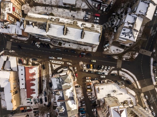 Preview: Aerial black and white winter top view of modern city with tall buildings