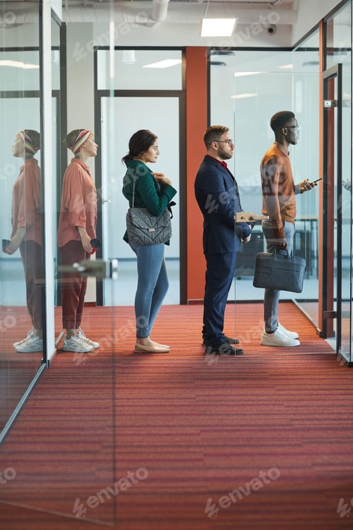 Preview: Business People Standing in Line in Office