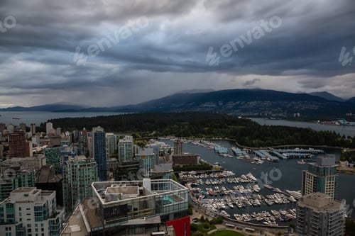 Preview: Aerial view of Downtown City during a stormy summer evening before sunset