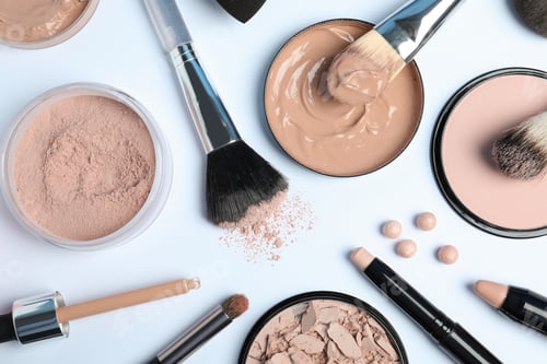 Preview: Flat lay composition with skin foundation, powder and beauty accessories on white background