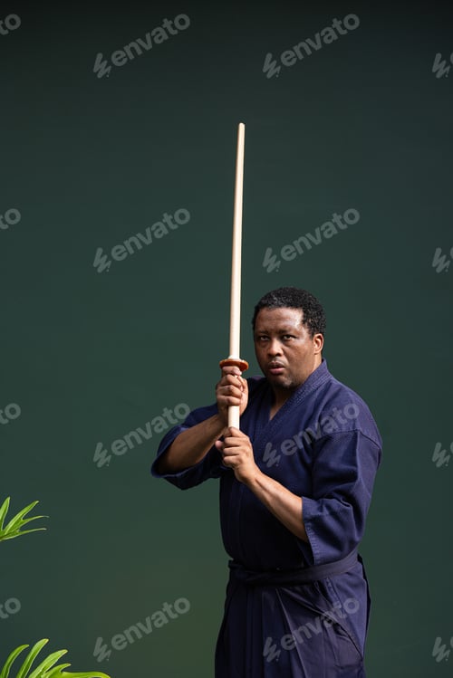 Preview: Handsome black martial artist man with martial arts costume of kendo