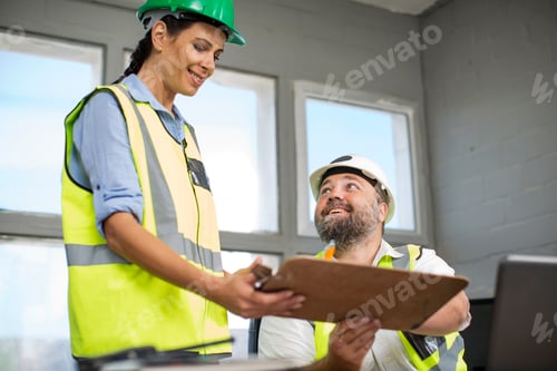 Preview: Male and female quarry staff having a meeting in site office