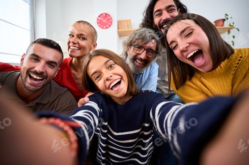 Preview: Cheerful Caucasian family taking selfie photo with funny expressions at home. Positive relations.