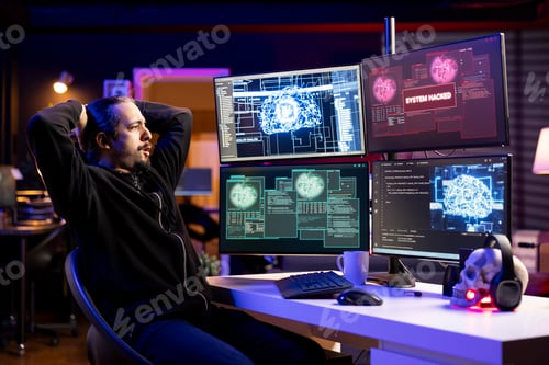 Preview: Rogue programmer at home coding on PC, using AI to evade security