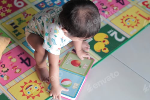Preview: Toddler Interacts with Educational Flashcards at Home