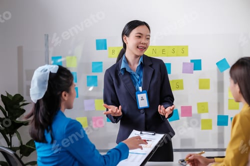 Preview: Business, board and Asian woman with presentation, planning and explain process at a workshop
