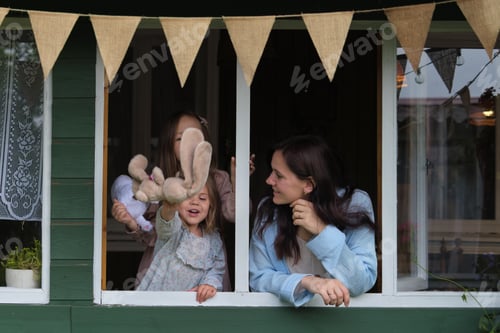 Preview: rhythmic sound of rainfall provides the backdrop for a lively tableau: a mother and her daughters