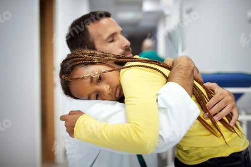 Preview: Doctor comforting, supporting a worried sad girl kid in hospital