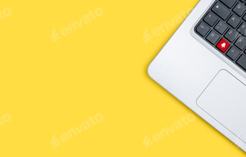 Preview: Laptop Keyboard Notification Bell Against Yellow Background