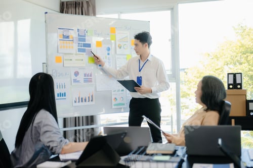 Preview: The boss stands near the board with graphs, demonstrates statistics, various personnel attending