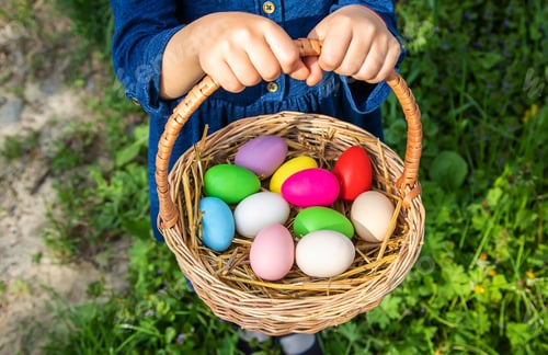 Preview: The child holds Easter eggs in his hands. Selective focus.